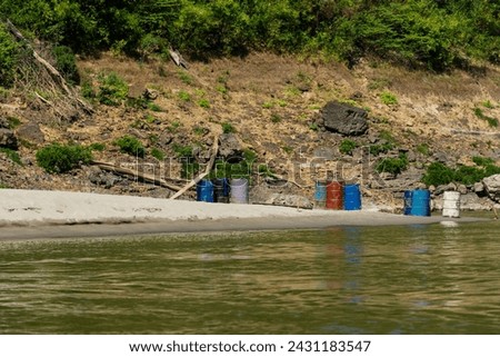 Oil tanks placed next to the river