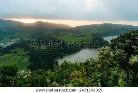 View of the Lake Furnas (Lagoa das Furnas) on Sao Miguel Island, Azores, Portugal from the Pico do Ferro scenic viewpoint. Tranquil scene of the lake in a volcanic crater Royalty-Free Stock Photo #2431196019
