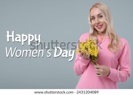 Happy Women's Day - March 8. Attractive lady with mimosa flowers on grey background