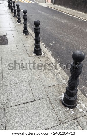 Decorative metal posts for road fencing.Structure of the urban environment.