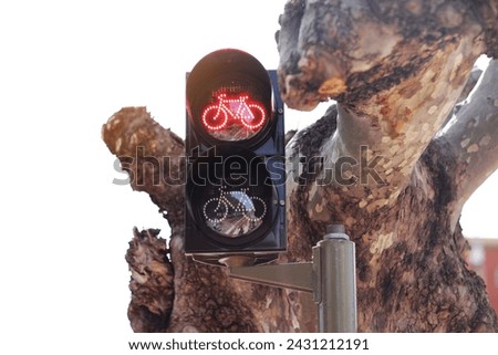 Red cycle bike traffic light in the european city. Urban traffic light with stoplight sign for cyclists and pedestrians. Bicycle traffic light with bicycle icon and active red resolving light