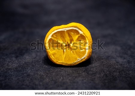 Half-Cut Lemon. Close-Up of Squeezed Lemon Halves. Dehydrated Lemon Slice. Lemon Half.  Royalty-Free Stock Photo #2431220921