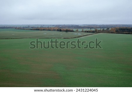 Drone photography of agriculture field and drainage ditch during autumn cloudy morning
