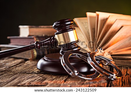 Wooden gavel and books on wooden table, law concept Royalty-Free Stock Photo #243122509