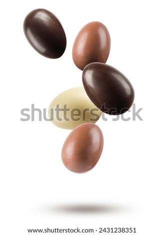 Chocolate easter eggs floating on white background. Royalty-Free Stock Photo #2431238351