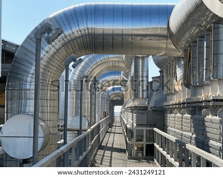 Insulated piping on a pipe rack Royalty-Free Stock Photo #2431249121