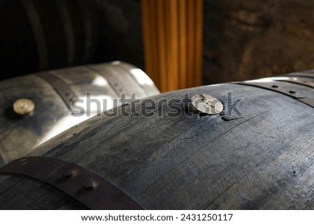 Close-up of a bung in a whisky cask. The bung closes the bung hole in the barrel to seal it.	 Royalty-Free Stock Photo #2431250117