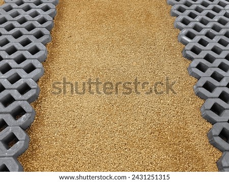 Laying cubes in the parking lot. The road construction process. Openwork slabs. Royalty-Free Stock Photo #2431251315