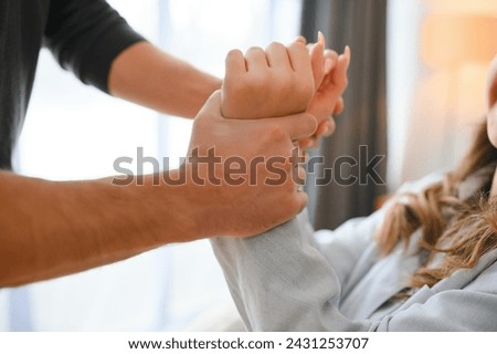 Man beating up his wife illustrating domestic violence. Royalty-Free Stock Photo #2431253707