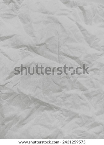grey crumpled tissue paper. texture background.
