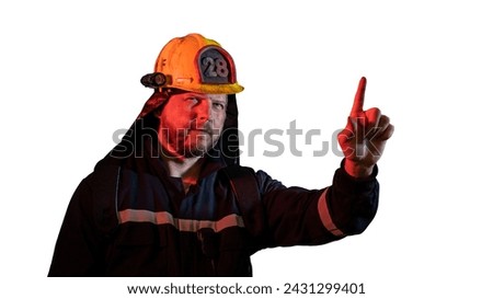 the male firefighter shows a hand gesture attention carefully