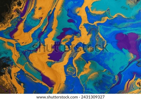 art photography of abstract marbleized effect background with blue, black, purple and gold creative colors. Beautiful paint. Royalty-Free Stock Photo #2431309327