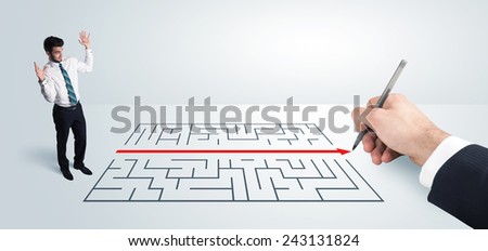 Business man looking at hand drawing solution for maze solution concept