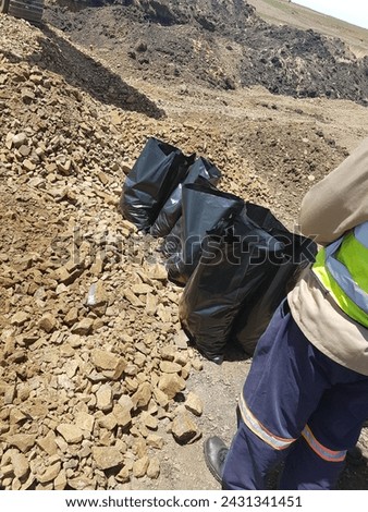 Laboratory black bags collecting materials sampled onsite testing quality checking technician road construction engineering civil decision making different  test CBR Density shrinkage grading analysis Royalty-Free Stock Photo #2431341451