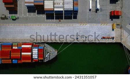 Aerial view of cargo ship loaded with containers in port