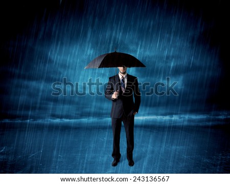 Business man standing in rain with an umbrella concept on background