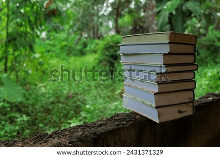 Books with in outdoor greenary
