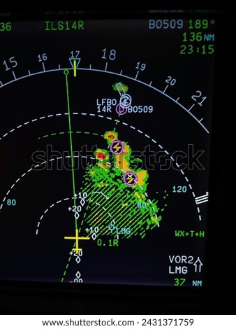 Navigation display of an airplane during an approach with thunderstorms on radar screen  Royalty-Free Stock Photo #2431371759