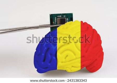 On a white background, a model of the brain with a picture of a flag - Romania, a microcircuit, a processor, is implanted into it. Close-up
