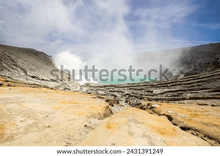Ijen volcano with turquoise-coloured acidic crater lake in East Java, Indonesia Royalty-Free Stock Photo #2431391249