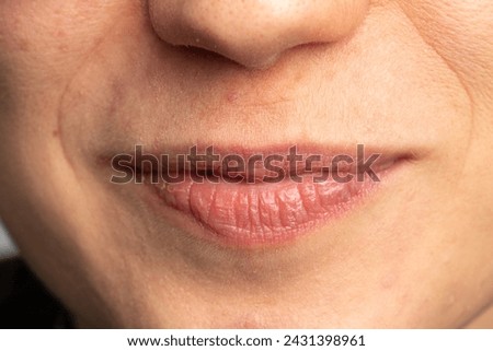A high-resolution macro shot revealing the intricate textures and subtle imperfections on the surface of a person's lips