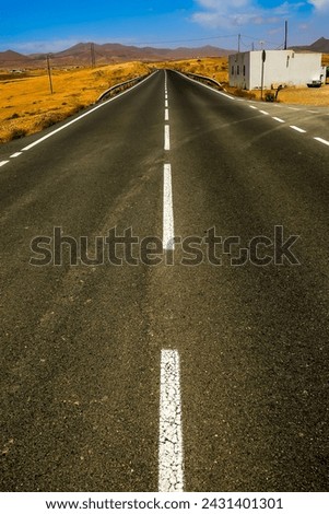 Photo Picture of a Beautiful Asphalt Lonely Road Royalty-Free Stock Photo #2431401301