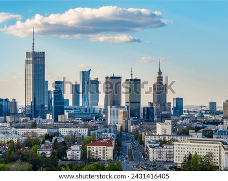 Warsaw city center, PKiN and skyscrapers under blue cloudy sky aerial landscape Royalty-Free Stock Photo #2431416405