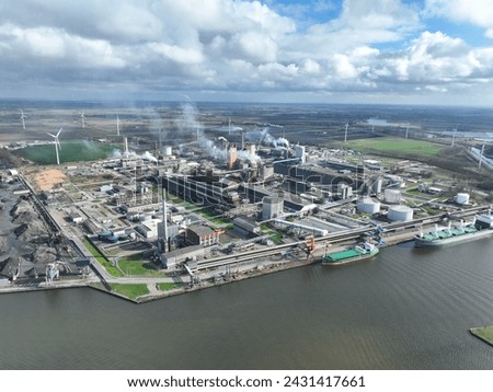 Fertilizer industry, production, smoke stacks at Sluiskil, Zeeland, The Netherlands. Aerial birds eye view. Heavy industry.