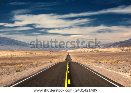 Visiting the Death Valley, road leading into the valley, California, USA
