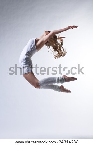 modern ballet dancer posing on white background