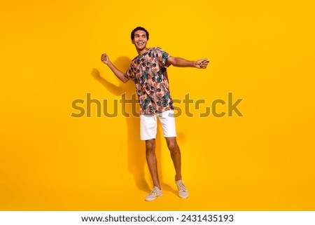 Full body length size photo of funky young man in t shirt with white shorts discotheque summertime isolated on yellow color background Royalty-Free Stock Photo #2431435193