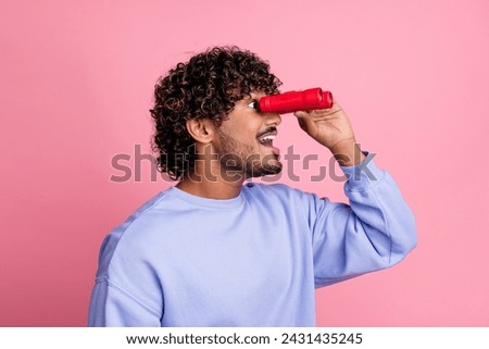 Photo of cheerful excited man wearing blue trendy clothes looking far away empty space sale discount isolated on pink color background