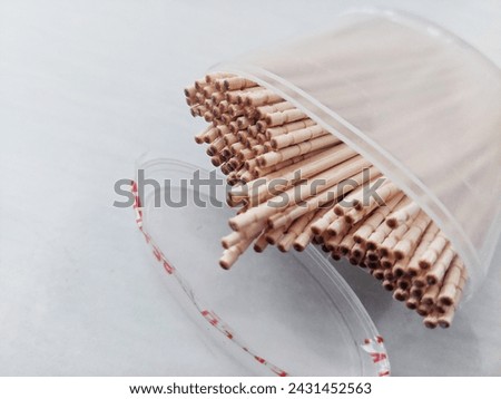 a toothpick holder with an open lid on a white background