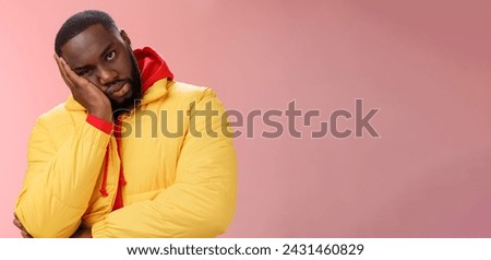 Annoyed bothered pissed african-american bearded man in yellow jacket facepalm look angry camera irritated lean head hand bored fed up pissed hearing uninteresting same stories, pink background. Royalty-Free Stock Photo #2431460829