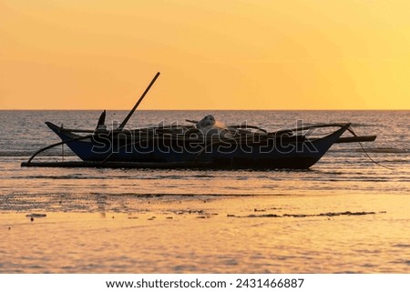 Picture of fishing boat in silhouette