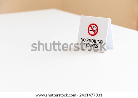 A sign indicating non-smoking seats on the table