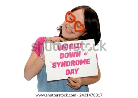 World Down Syndrome Day.A young woman with Down syndrome holds a banner celebrating the Royalty-Free Stock Photo #2431478817