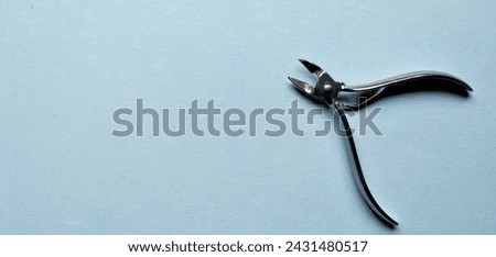 Hair cutting shears on a blue background. Top view.