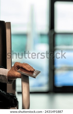Rome, Italy A woman holds a Swedish passport while waiting at the gate at the Leonardo Da Vinci Fiumicino airport.