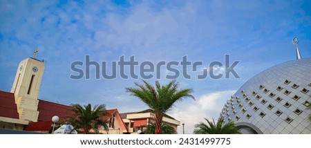 inter-religious tolerance in Indonesia, when mosques and churches live side by side Royalty-Free Stock Photo #2431499775