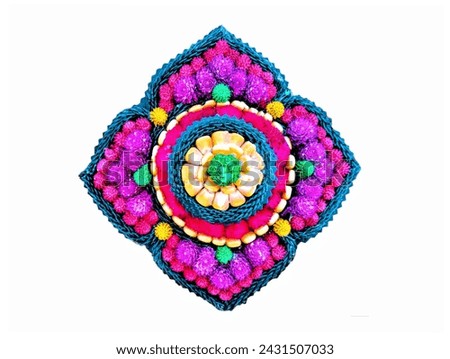 The white background in the picture is fresh flowers with pink, purple, green, and yellow amaranths decorated in a frame in the center of which are orange corn seeds.