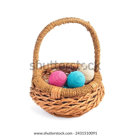 Wicker basket isolated on white background. Easter eggs.