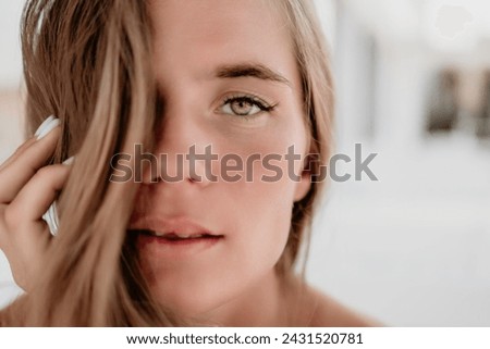 Happy woman portrait in cafe. Boho chic fashion style. Outdoor photo of young happy woman with long hair, sunny weather outdoors sitting in modern cafe.
