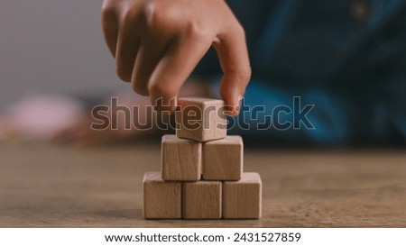 Blank wooden cubes on the table with copy space, empty wooden cubes for input wording, and an infographic icon..	

