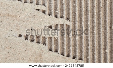 torn cardboard texture close up. brown cardboard background