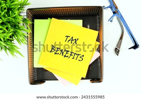 The concept of finance and business. TAX BENEFITS written on a yellow sticker