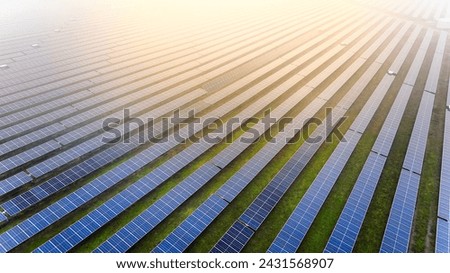 A picture showcasing a vast, contemporary photovoltaic solar farm. Royalty-Free Stock Photo #2431568907