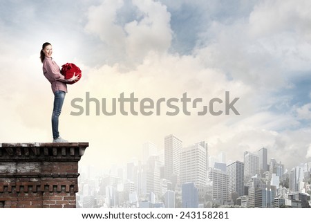Young girl with red santa bag in hands