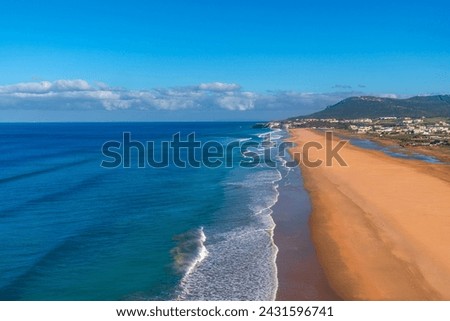 Aerial view of a beautiful beach on the Moroccan Atlantic Coast in Tanger, Morocco Royalty-Free Stock Photo #2431596741