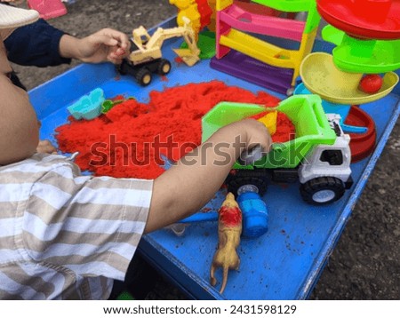 Toy sand and other children's play properties Royalty-Free Stock Photo #2431598129